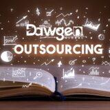 Business team reviewing financial dashboards and KPI reports as part of outsourced accounting strategy – Dawgen Global”